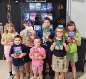 Second week students ROAR winners for showing Responsibility, Organization, Achievement and Respect received a token for the book vending machine at Maynard Elementary. Photo/Facebook