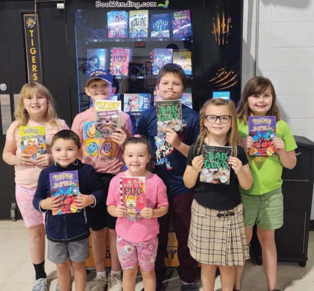 Second week students ROAR winners for showing Responsibility, Organization, Achievement and Respect received a token for the book vending machine at Maynard Elementary. Photo/Facebook